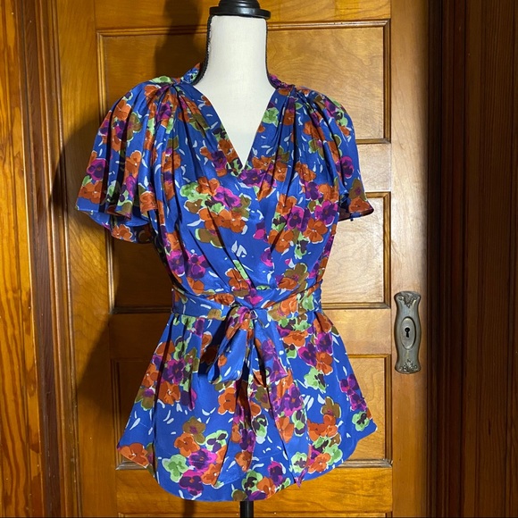 Anthropologie Tops - Peplum 100% silk V-neck blouse by Girls of Savoy